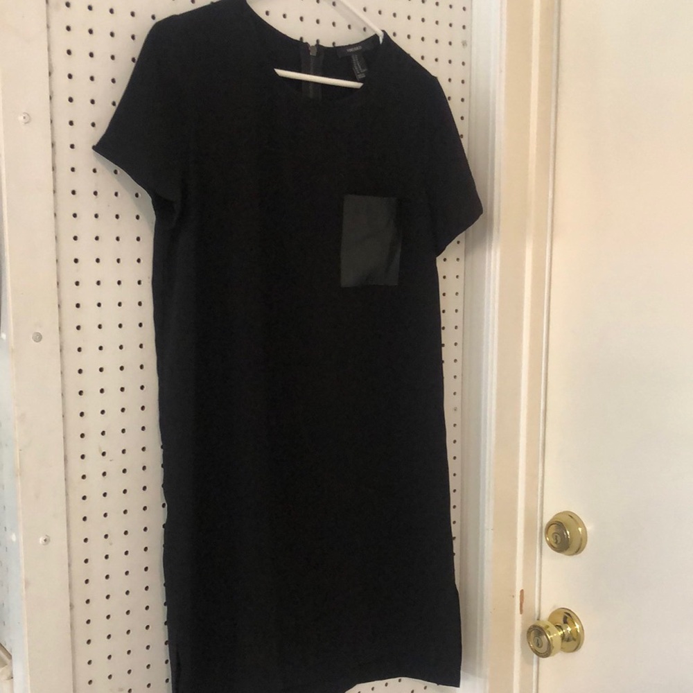 Black pullover dress with zipper. Leather pocket.